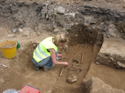 Malin excavating a medieval skeleton